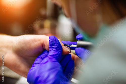 Nail care in salon. Selective focus on costumer's nails. Selective focus.