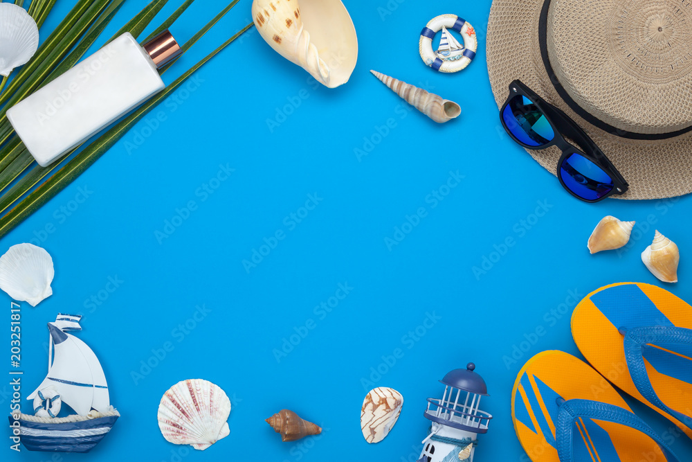 Table top view aerial image of accessory for summer travel holiday   lay essential objects for beach vacation on modern blue  paper at office  space for creative design text. Stock Photo |