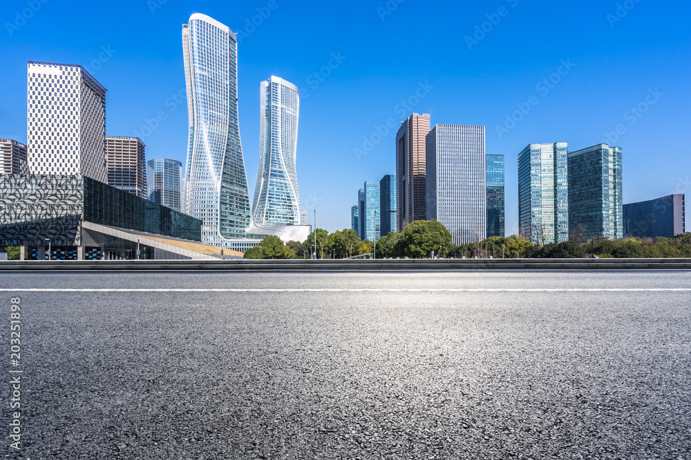 empty asphalt road with modern building in urban empty asphalt road with modern building in urban