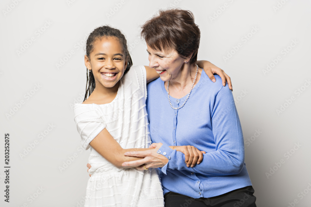 black girl child with grandmother in studio white background black girl child with grandmother in studio white background