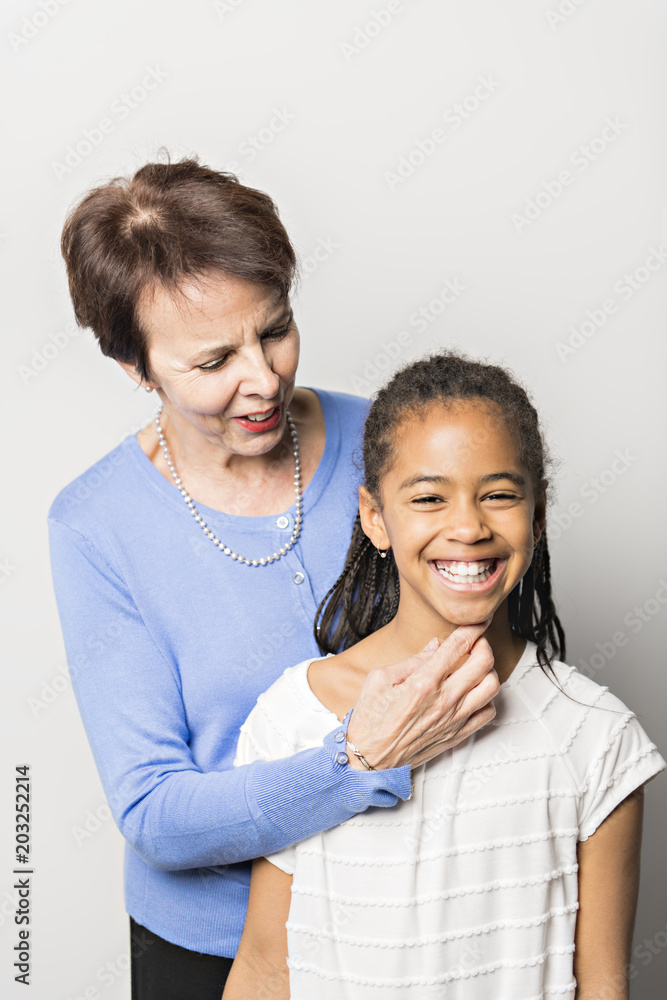 black girl child with grandmother in studio white background black girl child with grandmother in studio white background