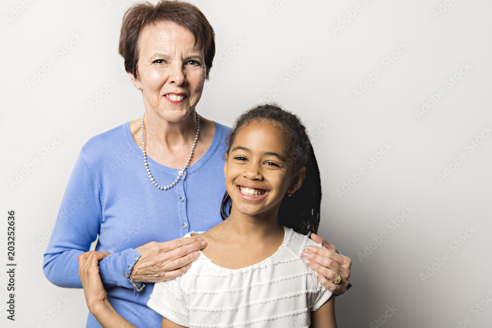 Obraz premium black girl child with grandmother in studio white background