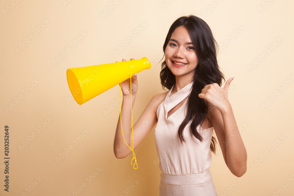 Beautiful young Asian woman show thumbs up announce with megaphone. Beautiful young Asian woman show thumbs up announce with megaphone.
