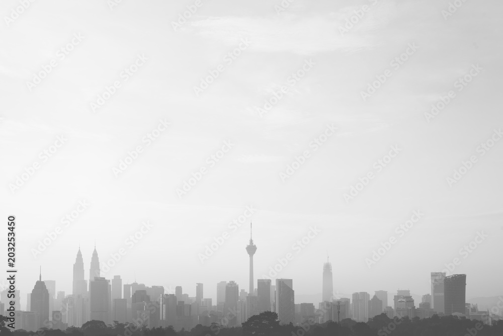 beautiful and dramatic view of Kuala Lumpur Cityscape skyline and buildings silhouette in black and white image with large copy space.
