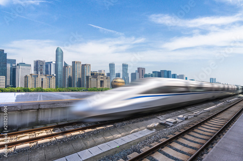 high speed train with panoramic cityscape