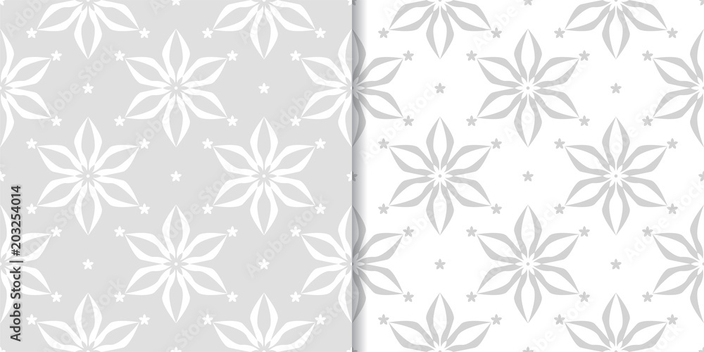 Light gray floral backgrounds. Set of seamless patterns Light gray floral backgrounds. Set of seamless patterns