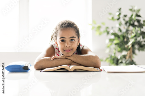 Black girl doing homework at home