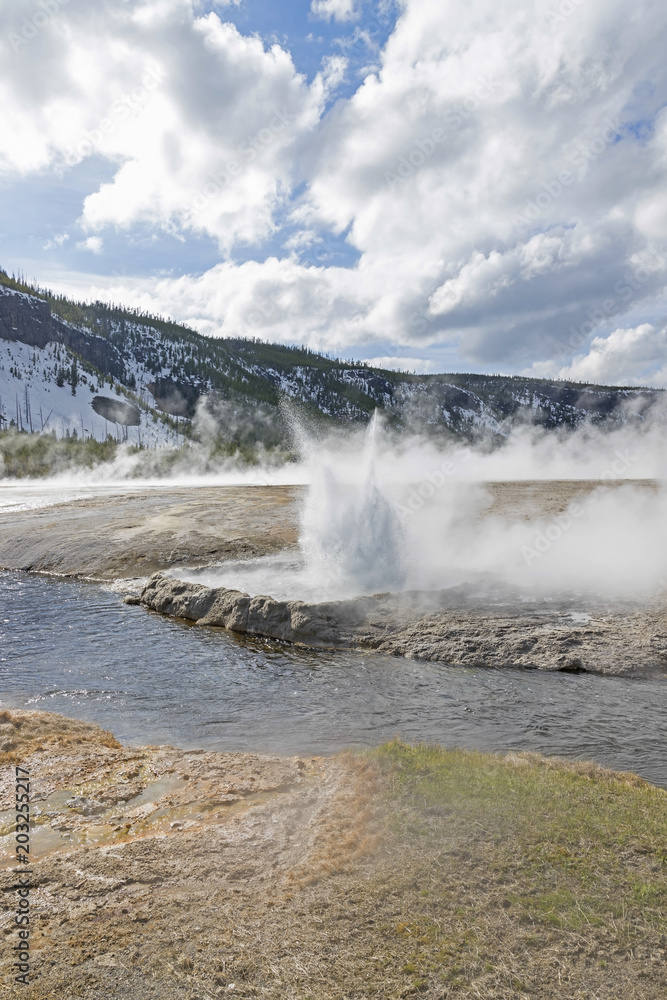 Yellowstone geyser explodes along the river Yellowstone geyser explodes along the river