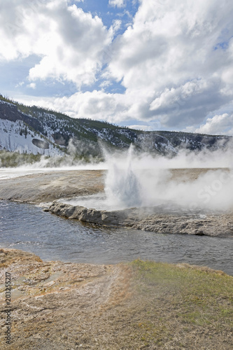 Yellowstone geyser explodes along the river