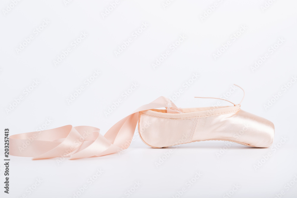 Pink ballet shoe isolated on a white background Pink ballet shoe isolated on a white background