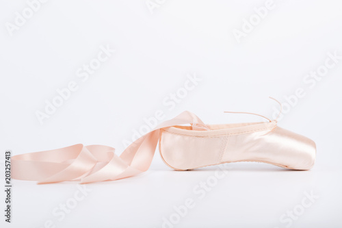 Pink ballet shoe isolated on a white background