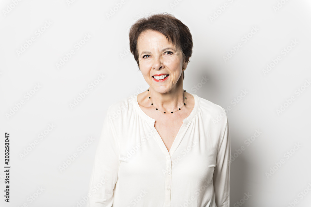 Happy joyful senior lady isolated on white background Happy joyful senior lady isolated on white background