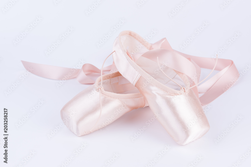 Pink ballet shoes isolated on a white background Pink ballet shoes isolated on a white background