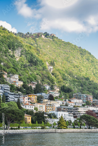 Panoramic view of quaint traditional waterfront houses on majestic Lake Como, Lombardy, Italy. © Alexandre Rotenberg
