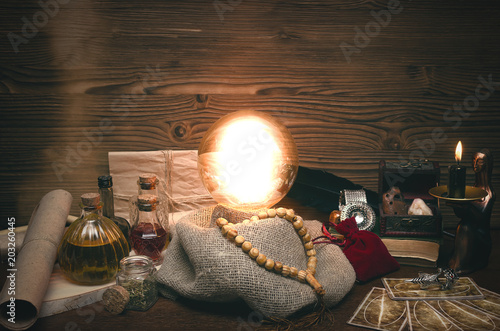 Crystal ball and tarot cards on fortune teller desk. Future reading concept. Paranormal magic table.