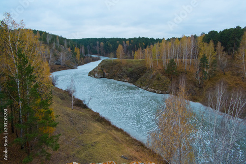 Autumn landscape with forests and river, Kislokan, Evenk, Russia photo