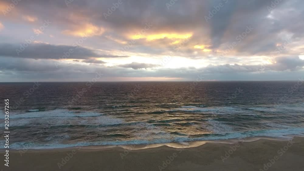 fyling slowly over an empty beach into sunset at atlantic ocean, 4k landscape footage (france) fyling slowly over an empty beach into sunset at atlantic ocean, 4k landscape footage (france)