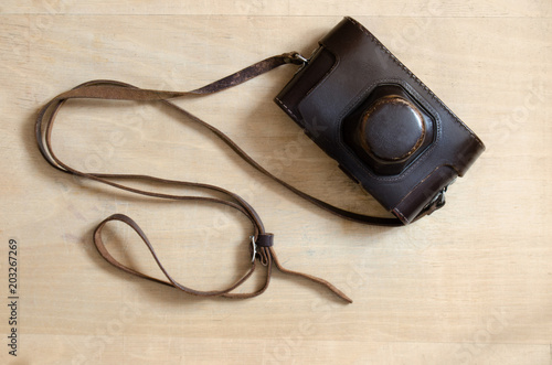 Vintage camera on a wooden desk