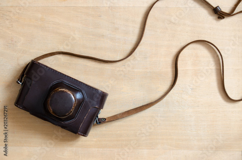 Vintage camera on a wooden desk