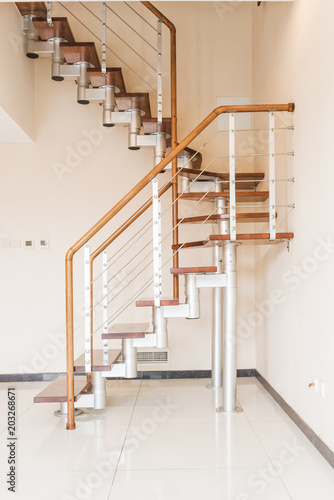 Stair. Solid newel stairs with wooden steps. Modern style.