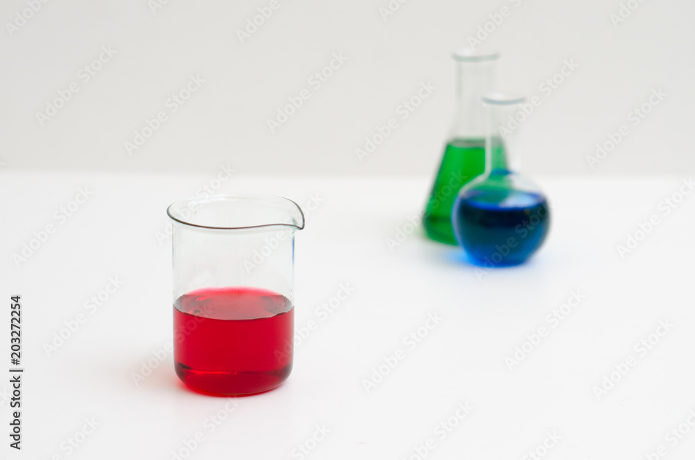 Chemistry glasses filled with colorful liquids Chemistry glasses filled with colorful liquids