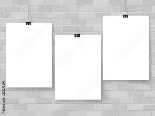 Posters on binder clips. White notepad paper templates. Brick wall. Business. Canvas. Interior. Realistic vector illustration. Empty mockup frames for your drawings, quotes or lettering.