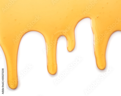 Dripping honey isolated on white background