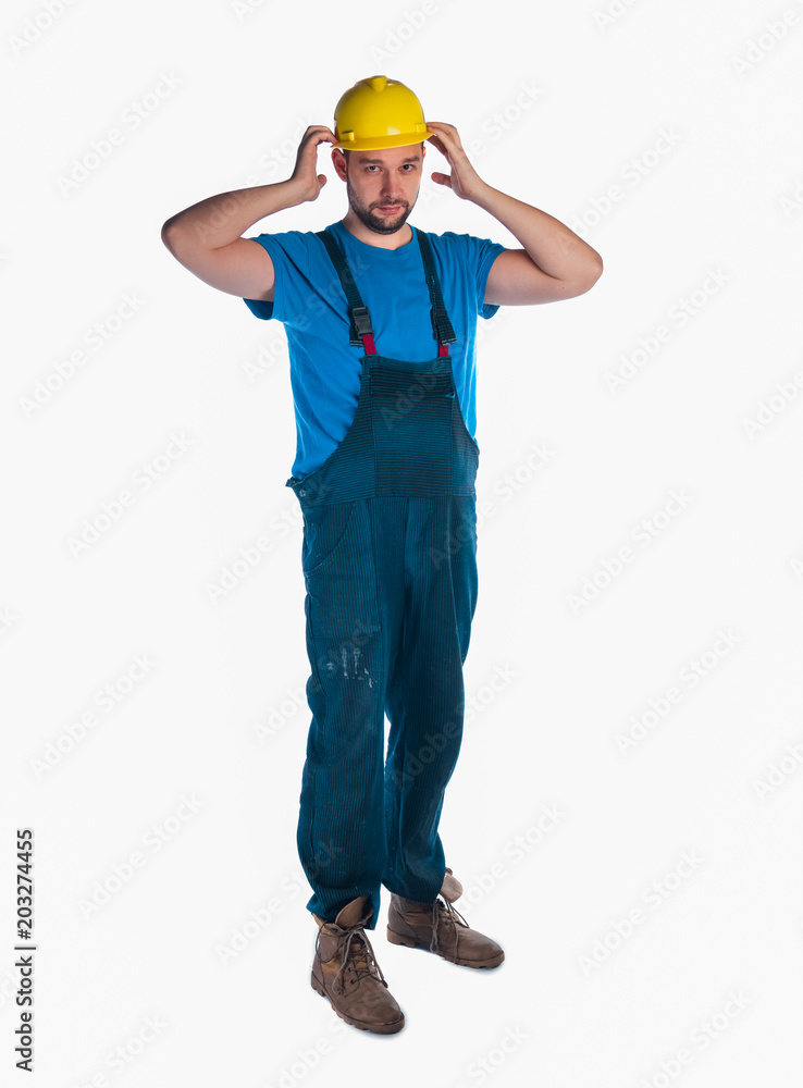 Portrait of a young worker standing on white background Portrait of a young worker standing on white background