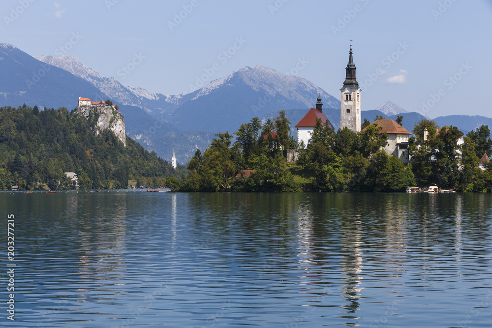 Church on Island in Lake Bled, Slovenia, with Castle in distance