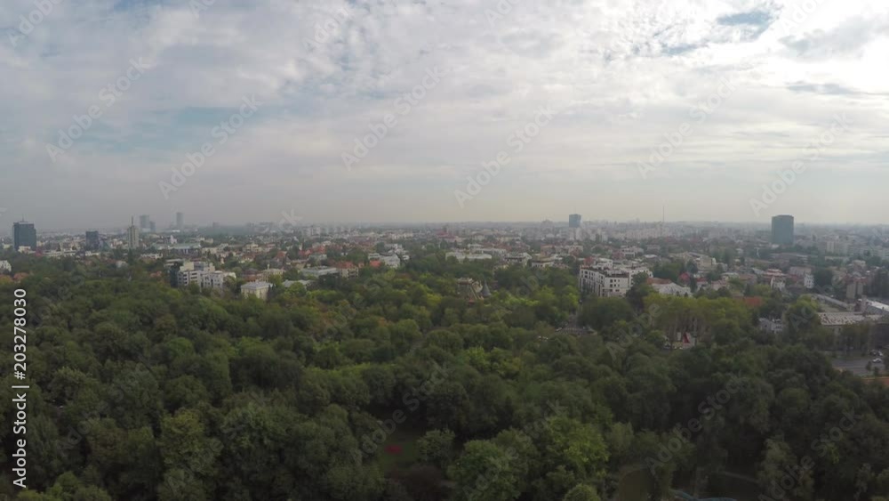 Aerial view of a green park and Bucharest city Aerial view of a green park and Bucharest city