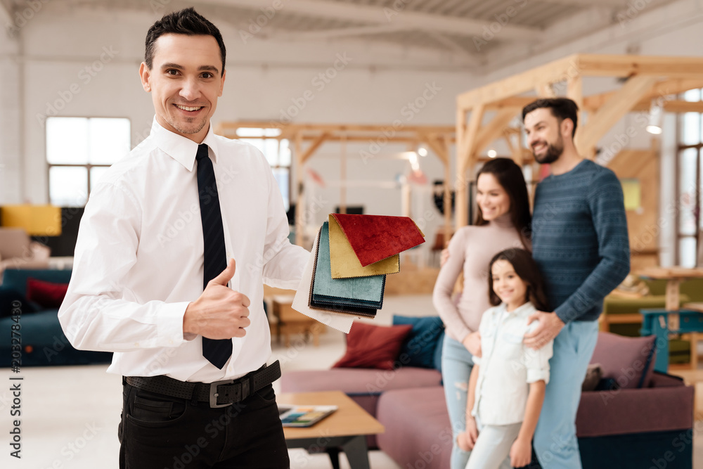 © Vadym Huzhva - Furniture retailer in the store looking at the camera.