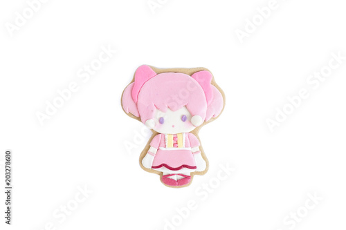 Cute cookie isolated on a white background. Gingerbread with sugar glazed of a little girl in pink with pigtails, very cute Japanese style lolita dress.