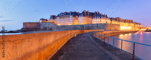 Night panoramic view of famous walled port city of Privateers Saint-Malo is known as city corsaire, Brittany, France
