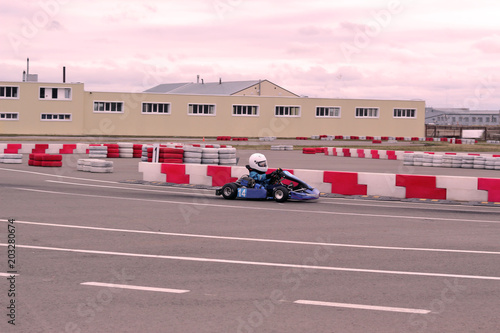 A child is riding a race car