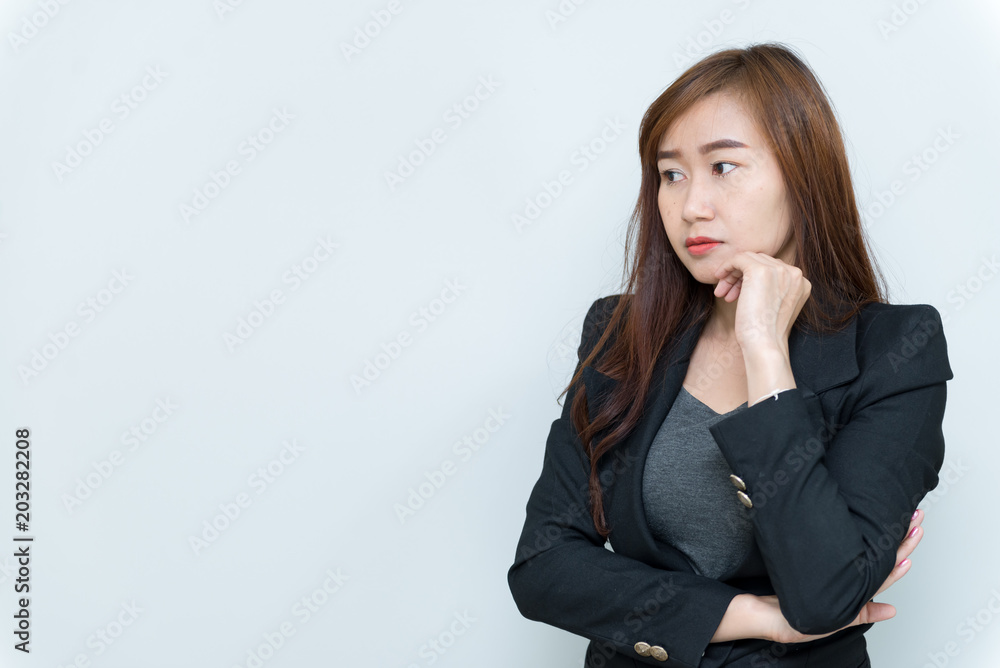 Beautiful asian business woman think something on white background,Thailand people,Stress from work,Sad woman concept Beautiful asian business woman think something on white background,Thailand people,Stress from work,Sad woman concept