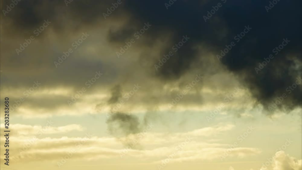 Dark and dramatic storm cloud area background. Time Lapse. Epic storm tropical clouds at sunset. Timelapse 4K UHD. Dark and dramatic storm cloud area background. Time Lapse. Epic storm tropical clouds at sunset. Timelapse 4K UHD.
