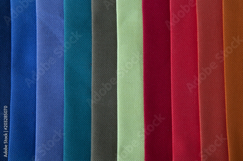 Samples of textiles. Multicolored fabric. Fabric production.