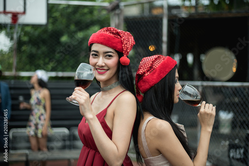 Young people holding glass talk in the party. photo