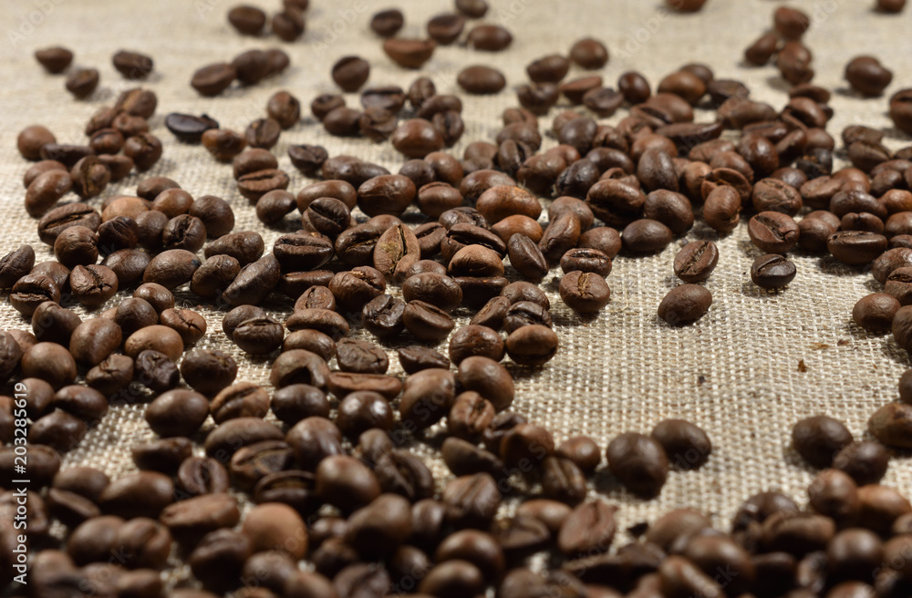 coffee beans on a background of burlap coffee beans on a background of burlap