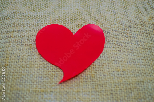 Heart shaped red stickers on the background.