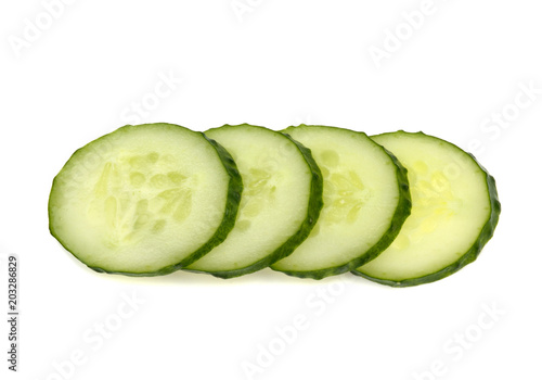 sliced fresh green cucumber on a white background