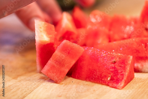 Hands Slicing Watermelon