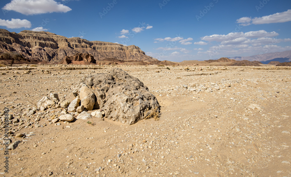 Volcanic bomb in geological Timna park that is located 25 km north of Eilat (Israel), combines beautiful scenery with unique geology, variety of sport and family activities