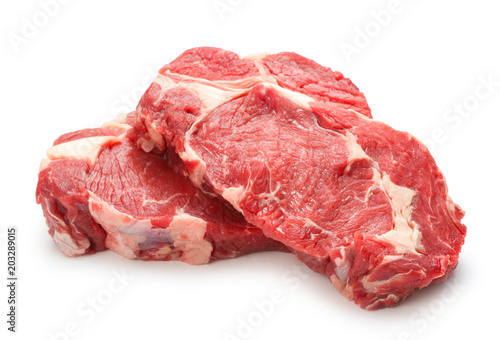 Raw steaks isolated on white background