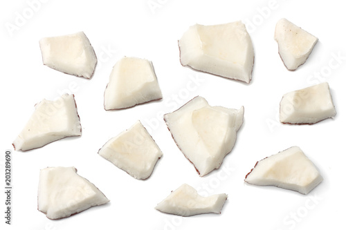 Coconut pieces isolated on white background. top view