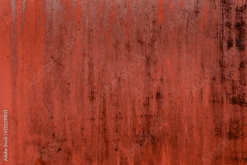 Red  rusty background with peeling paint.