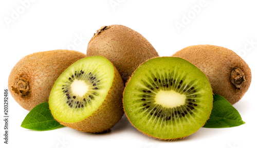 Ripe kiwi and halves with leaves on a white background.