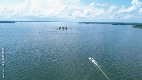 Aerial Drone View of Boat on Lake with Island photo