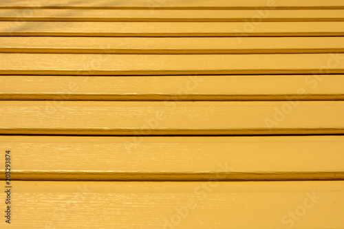 Texture of siding light brown with perspective