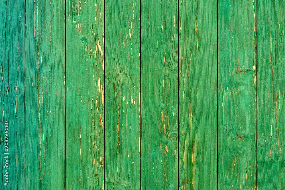 Amazingly beautiful old texture of a green wooden wall with cracked paint Amazingly beautiful old texture of a green wooden wall with cracked paint